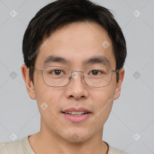 Joyful asian young-adult male with short  brown hair and brown eyes