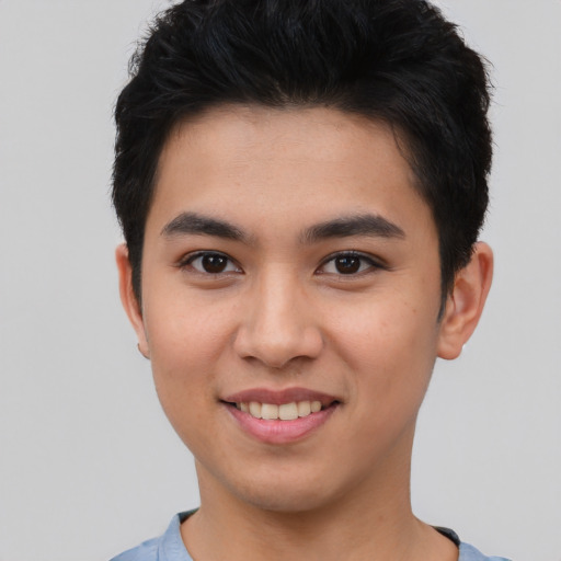 Joyful asian young-adult male with short  black hair and brown eyes