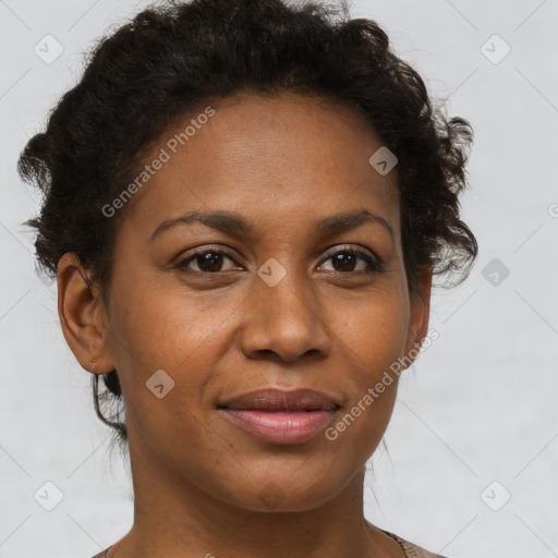 Joyful black adult female with short  brown hair and brown eyes