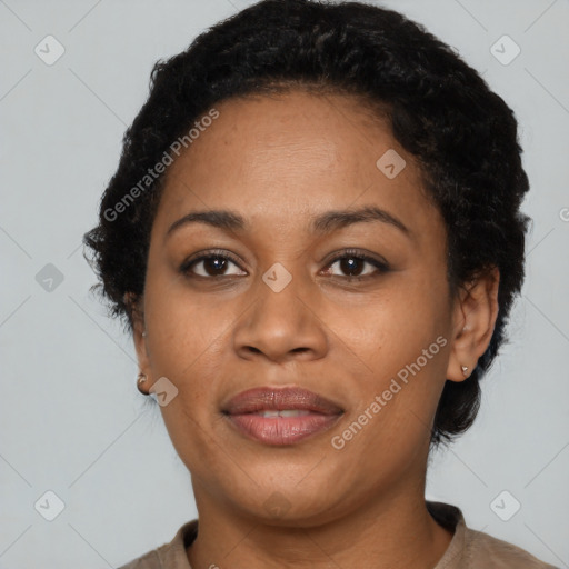 Joyful black adult female with short  black hair and brown eyes