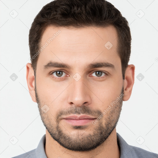 Neutral white young-adult male with short  brown hair and brown eyes