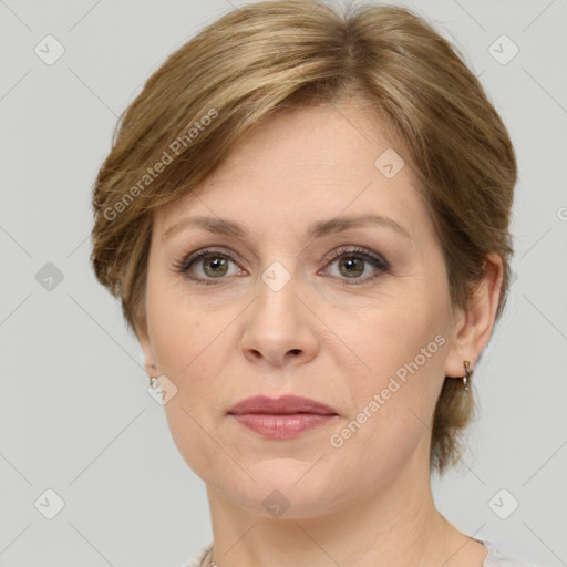 Joyful white adult female with medium  brown hair and grey eyes