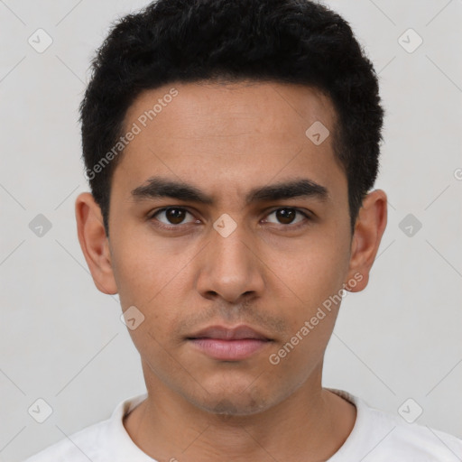 Neutral latino young-adult male with short  black hair and brown eyes