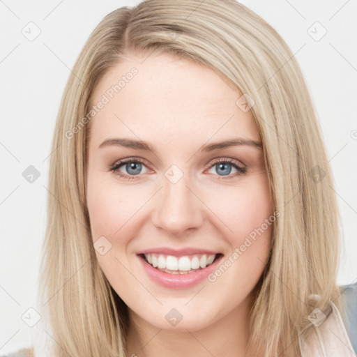 Joyful white young-adult female with long  brown hair and blue eyes