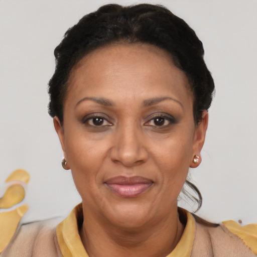Joyful latino adult female with short  black hair and brown eyes