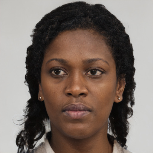 Neutral black young-adult female with long  black hair and brown eyes