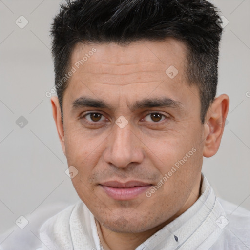 Joyful white adult male with short  brown hair and brown eyes