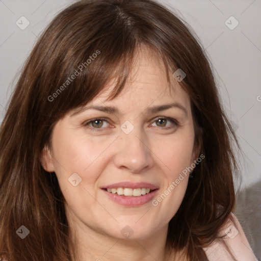 Joyful white adult female with medium  brown hair and brown eyes