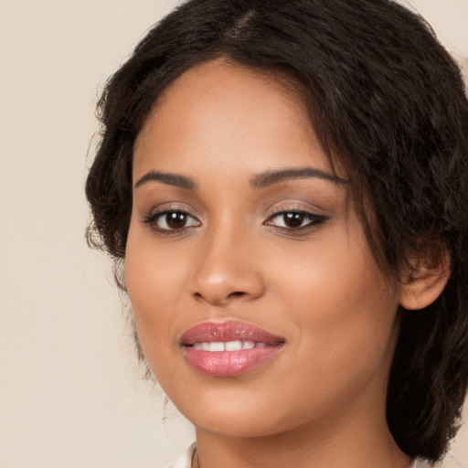 Joyful white young-adult female with long  brown hair and brown eyes