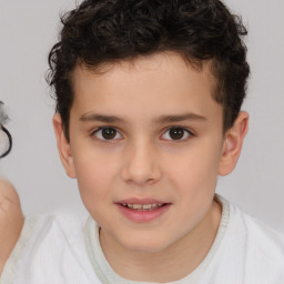 Joyful white child male with short  brown hair and brown eyes