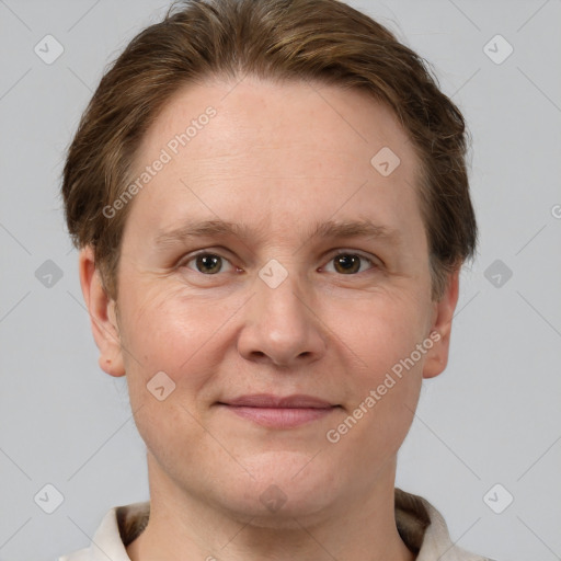 Joyful white adult female with short  brown hair and grey eyes