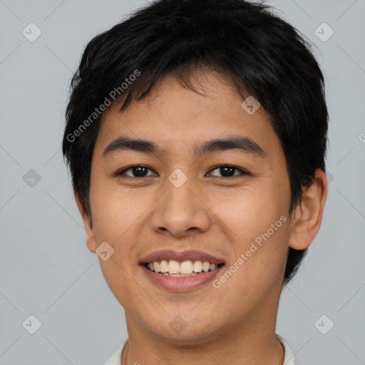 Joyful asian young-adult male with short  brown hair and brown eyes