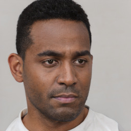 Neutral black young-adult male with short  black hair and brown eyes