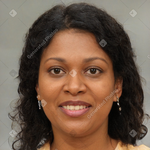 Joyful black adult female with medium  brown hair and brown eyes