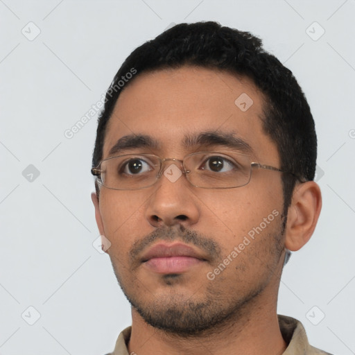 Neutral latino young-adult male with short  black hair and brown eyes