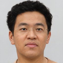 Neutral asian young-adult male with short  brown hair and brown eyes