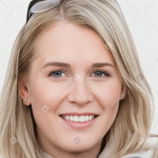 Joyful white young-adult female with long  brown hair and blue eyes