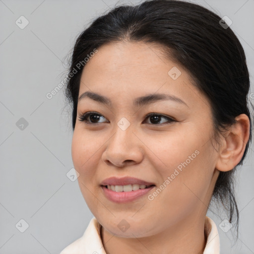 Joyful asian young-adult female with medium  brown hair and brown eyes