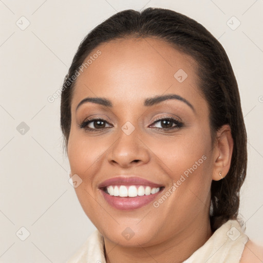 Joyful white young-adult female with medium  brown hair and brown eyes