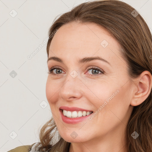 Joyful white young-adult female with medium  brown hair and blue eyes