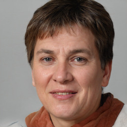 Joyful white adult male with short  brown hair and grey eyes