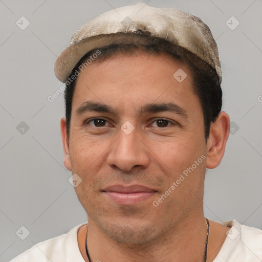 Joyful white adult male with short  black hair and brown eyes