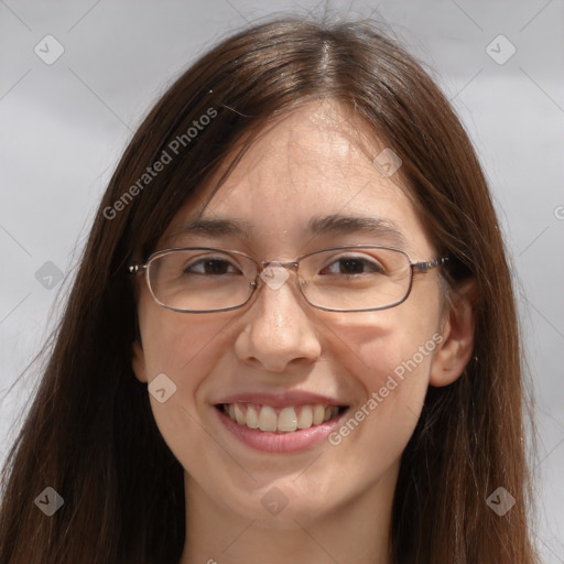 Joyful white adult female with long  brown hair and brown eyes