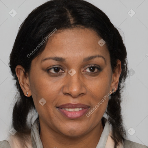 Joyful black adult female with medium  brown hair and brown eyes