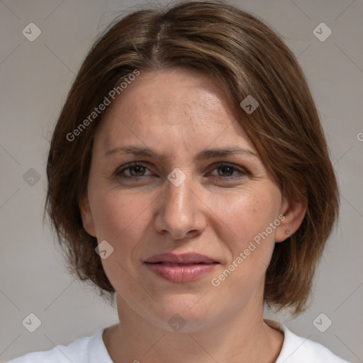 Joyful white adult female with medium  brown hair and brown eyes