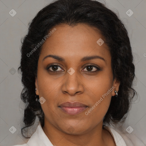 Joyful black adult female with medium  brown hair and brown eyes