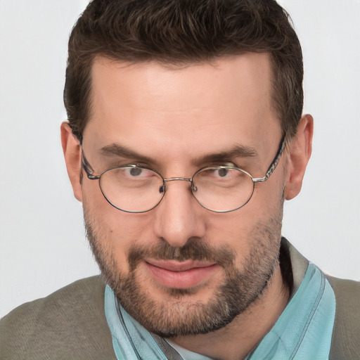 Joyful white adult male with short  brown hair and brown eyes