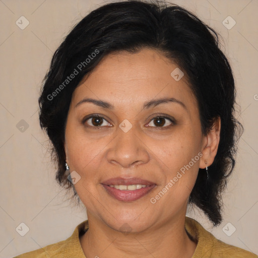 Joyful latino adult female with medium  brown hair and brown eyes