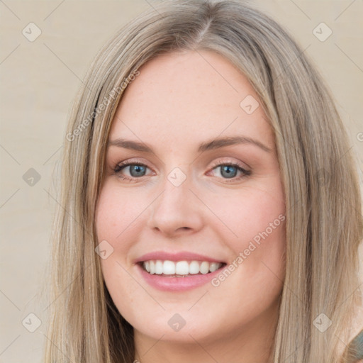 Joyful white young-adult female with long  brown hair and green eyes