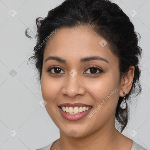 Joyful latino young-adult female with long  black hair and brown eyes