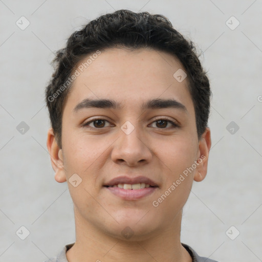 Joyful latino young-adult male with short  brown hair and brown eyes