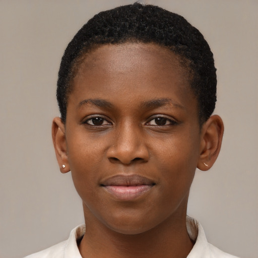 Joyful black child female with short  brown hair and brown eyes