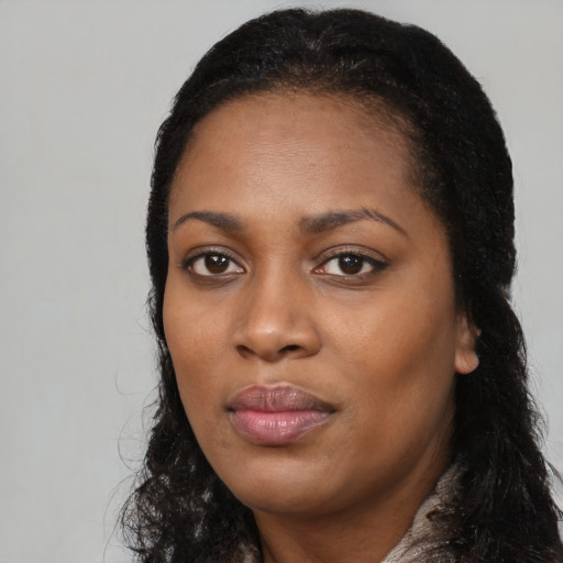 Neutral black young-adult female with long  black hair and brown eyes