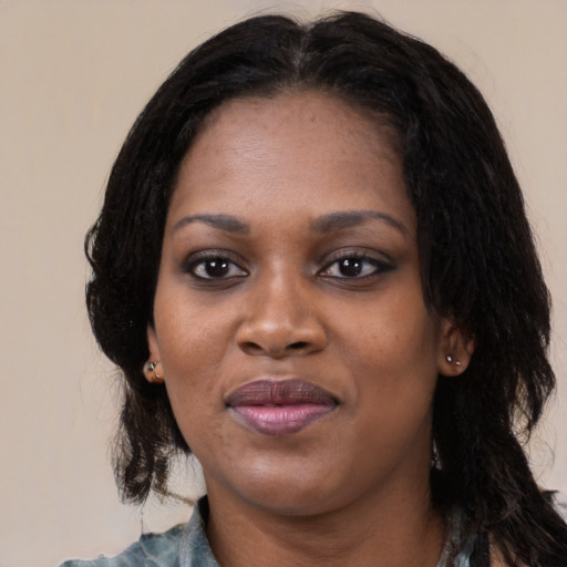 Joyful black young-adult female with medium  black hair and brown eyes
