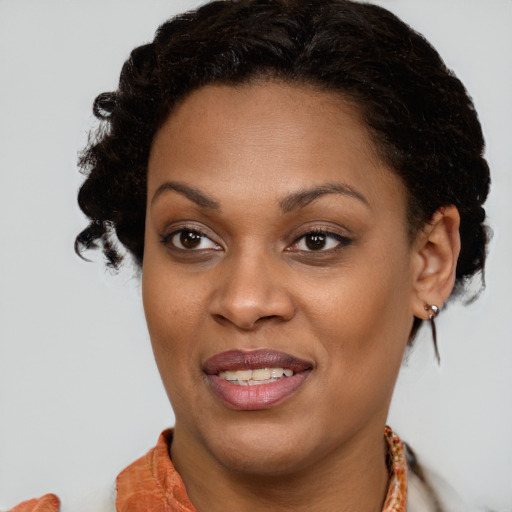 Joyful black young-adult female with medium  brown hair and brown eyes