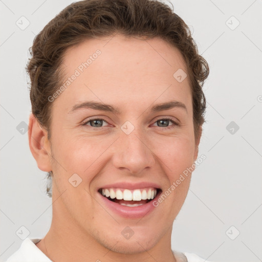 Joyful white young-adult female with short  brown hair and grey eyes