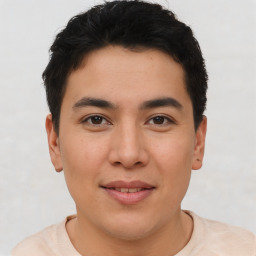 Joyful asian young-adult male with short  brown hair and brown eyes