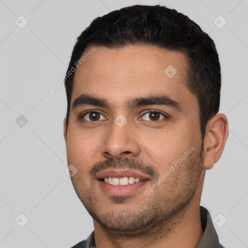 Joyful white young-adult male with short  black hair and brown eyes