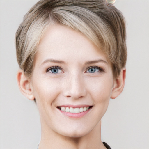 Joyful white young-adult female with short  brown hair and grey eyes