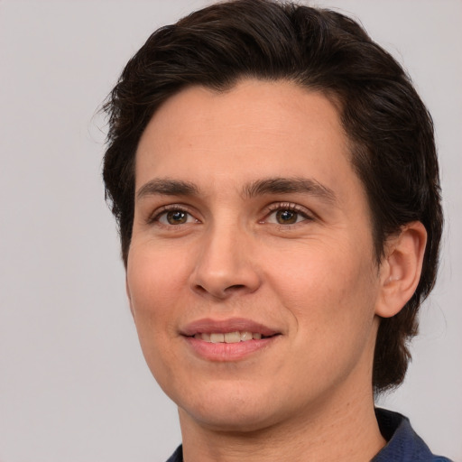 Joyful white young-adult male with medium  brown hair and brown eyes