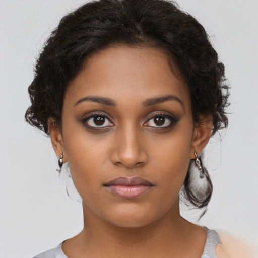 Neutral black young-adult female with short  brown hair and brown eyes