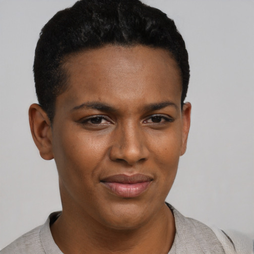 Joyful black young-adult female with short  black hair and brown eyes