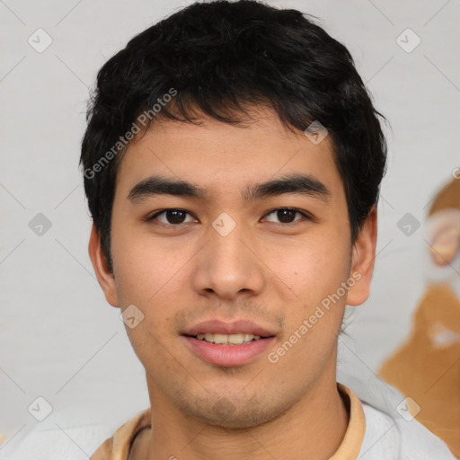 Joyful asian young-adult male with short  black hair and brown eyes