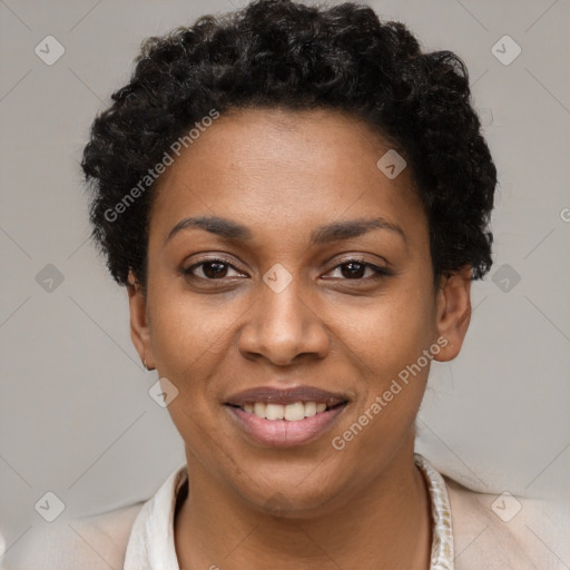 Joyful black young-adult female with short  black hair and brown eyes