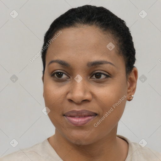 Joyful black young-adult female with short  black hair and brown eyes