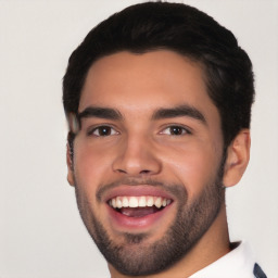 Joyful white young-adult male with short  black hair and brown eyes